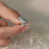 Twist band lab diamond ring on jewelry box, modern criss cross design