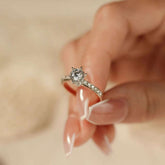 close-up six-prong solitaire, lab diamond 0.8 ct, pavé shoulders