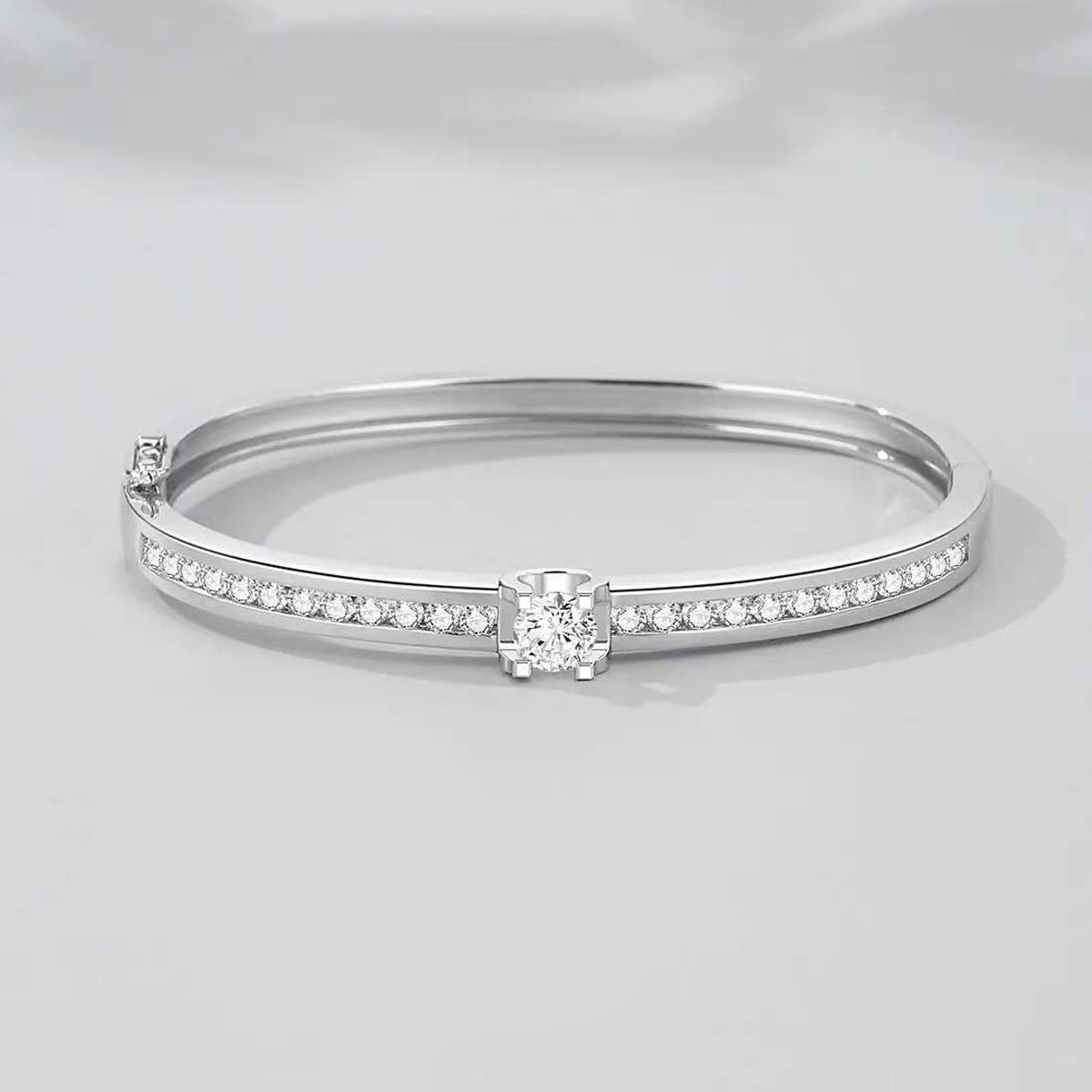 Timeless Sparkle: Elegant Sterling Silver Bangle with Central Stone