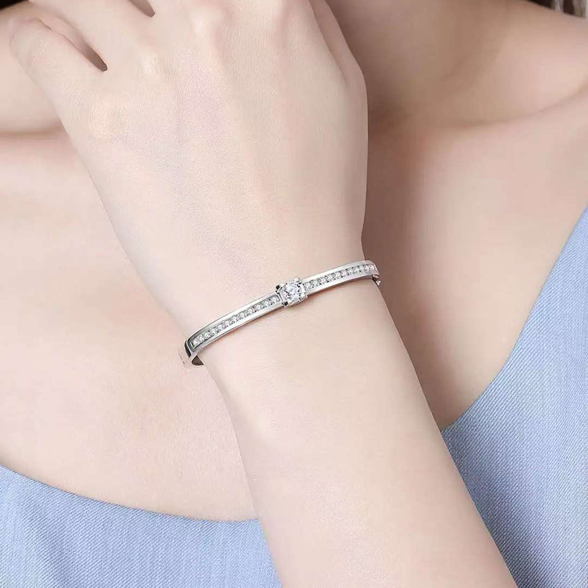 Timeless Sparkle: Elegant Sterling Silver Bangle with Central Stone