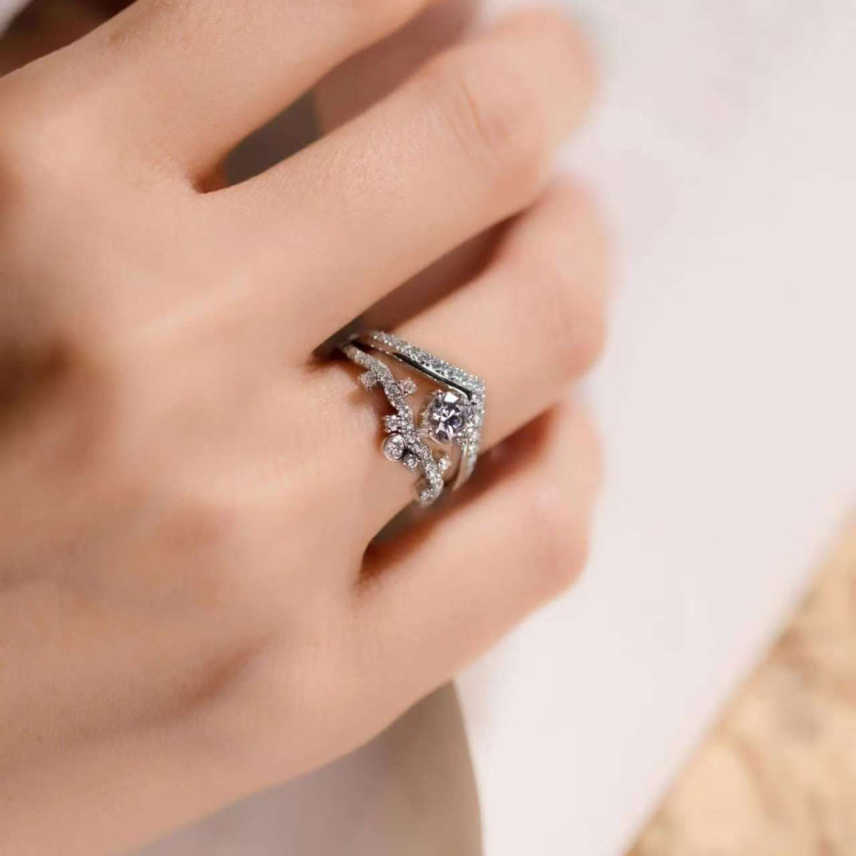 crown lab diamond ring stacked with V band on hand, dainty style