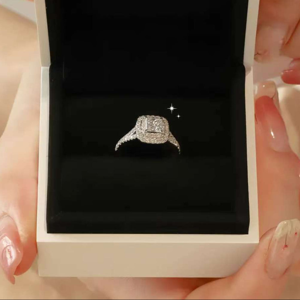 white gold halo engagement ring in velvet box