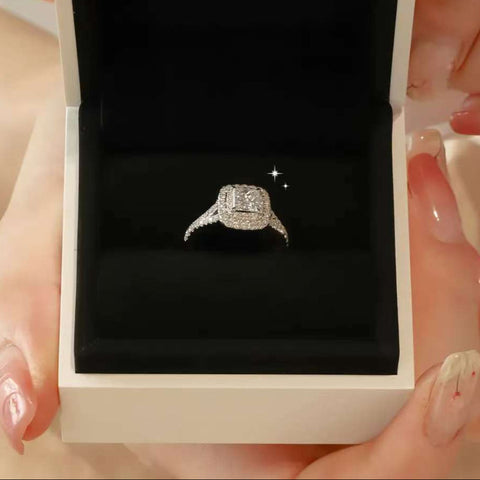white gold halo engagement ring in velvet box