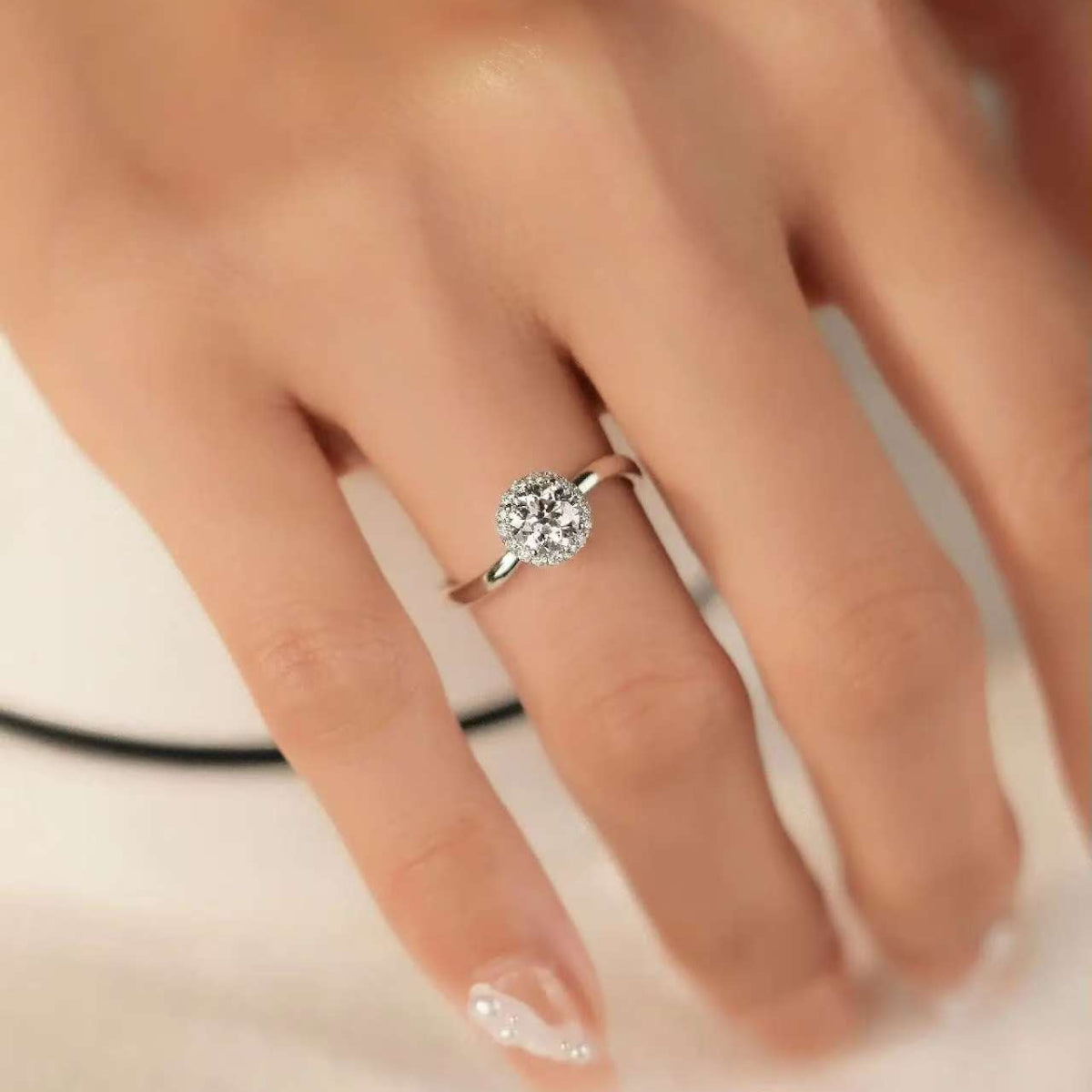 Classic halo setting engagement ring with lab diamond center