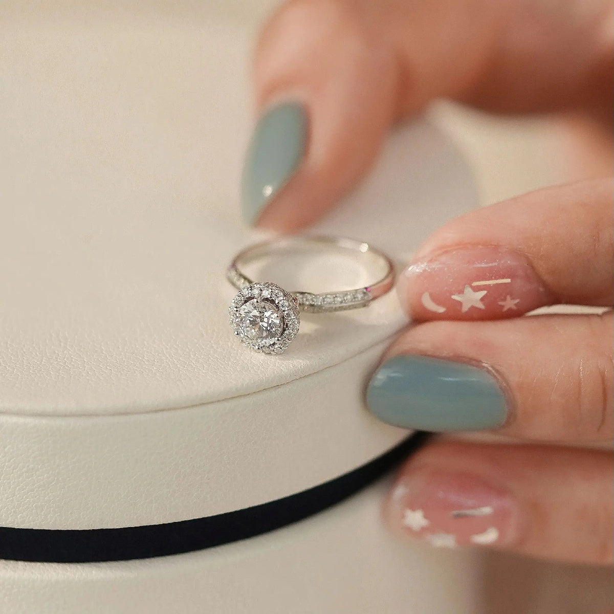 halo lab-grown diamond engagement ring on hand, 14K white gold pavé band
