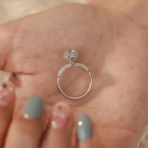 underside of halo ring showing hidden ruby accents beneath crown, 14K gold setting