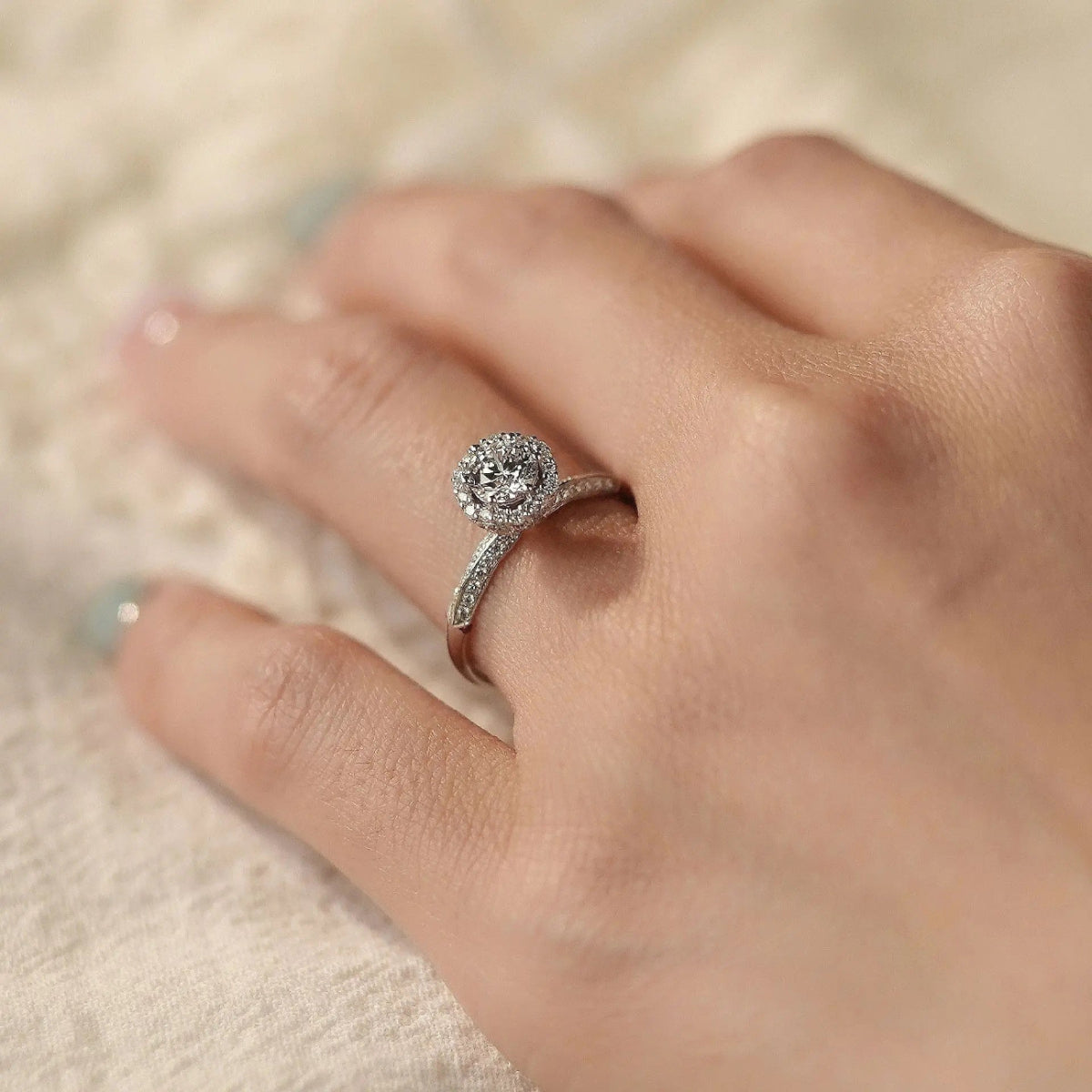round halo lab diamond ring top view, sparkling pavé shank, ethical bridal jewelry