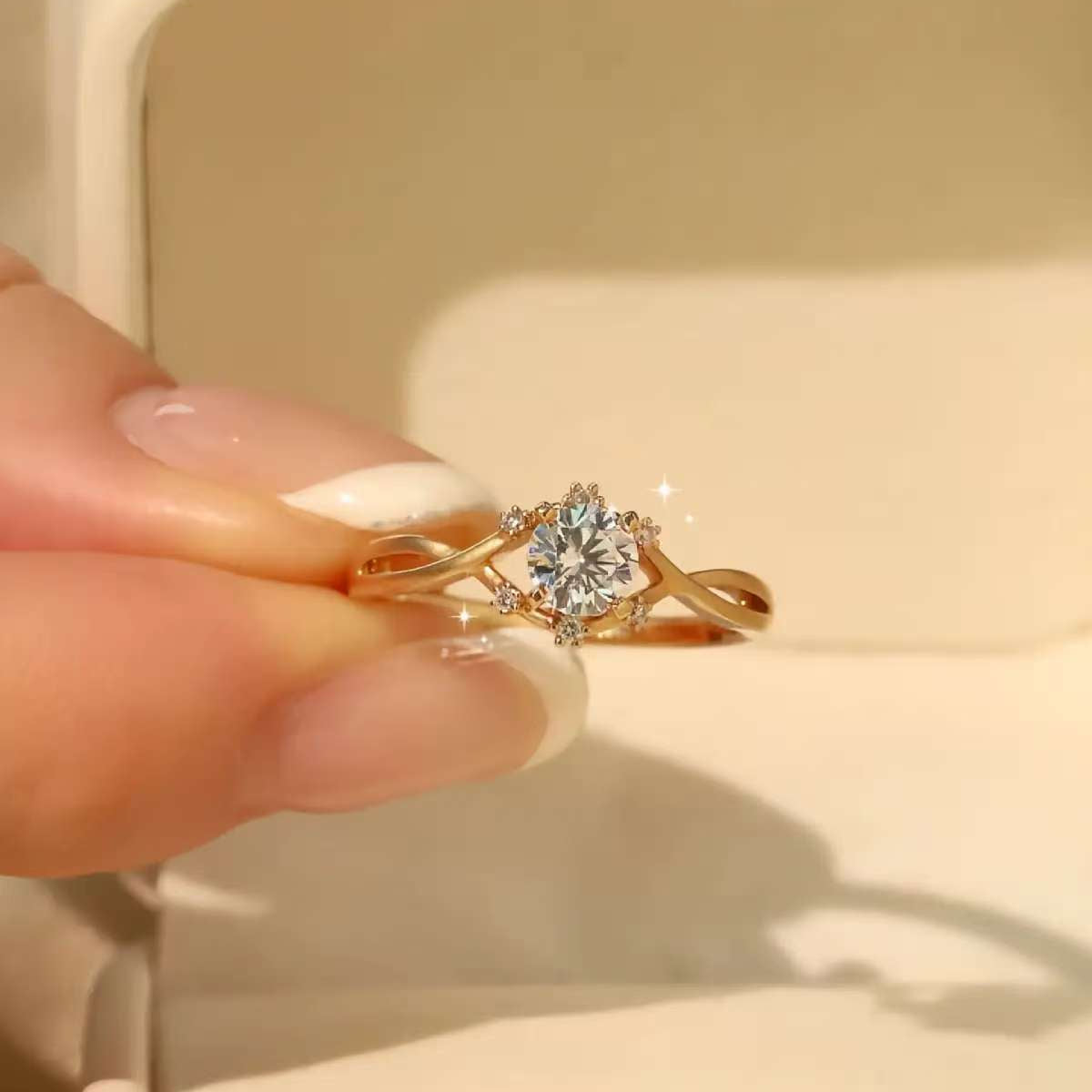 18K gold infinity twist diamond ring displayed in a jewelry box