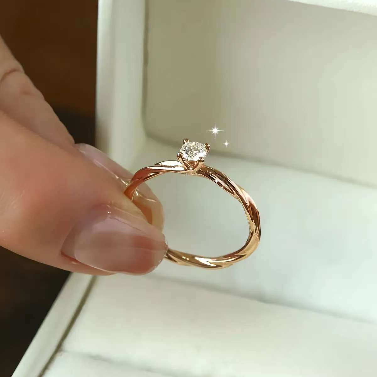 minimalist twisted band 0.25ct lab diamond solitaire ring in rose gold box
