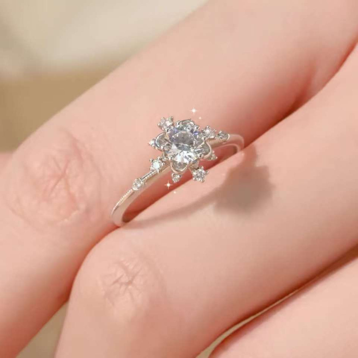 Snowflake lab grown diamond ring on hand, elegant winter jewelry
