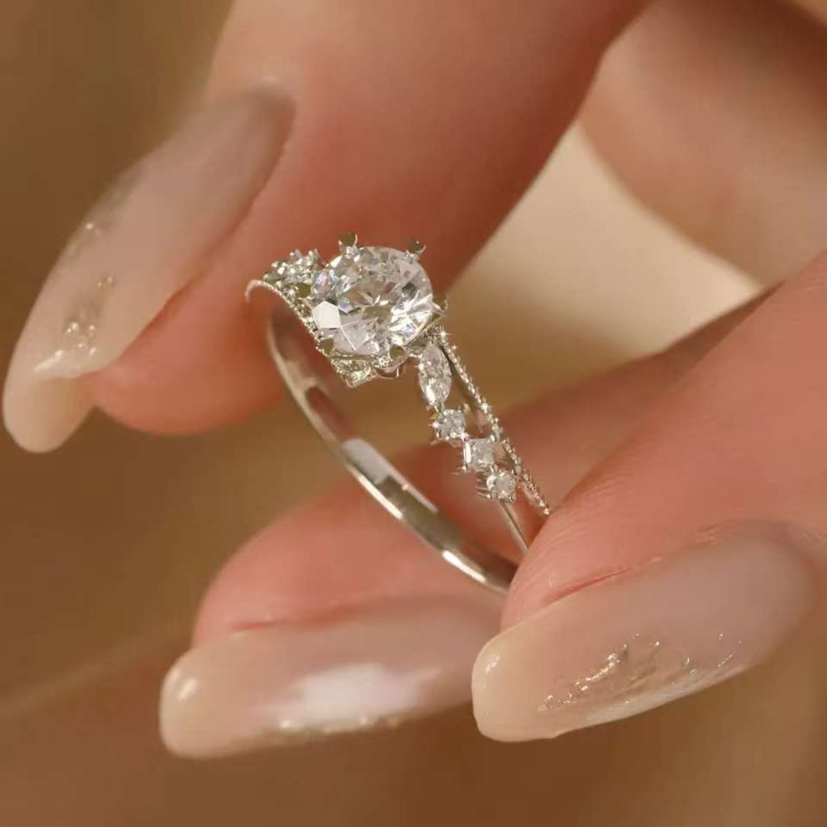 Close-up of round brilliant diamond halo ring, 18K gold, fine jewelry detail