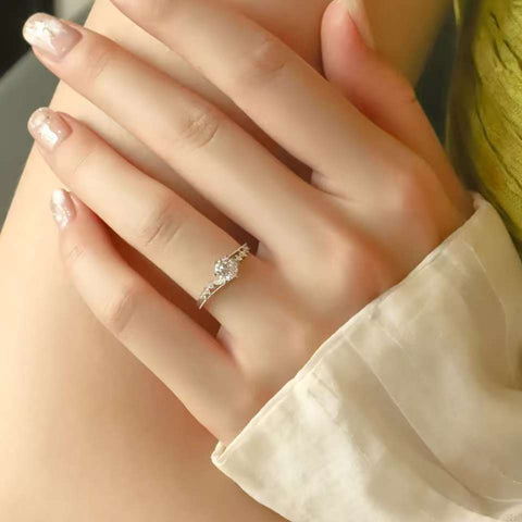 Sparkling round cut diamond ring, micro pavé accents, elegant bridal accessory