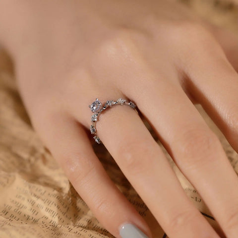vine-inspired lab diamond ring on hand, dainty band, ethical engagement
