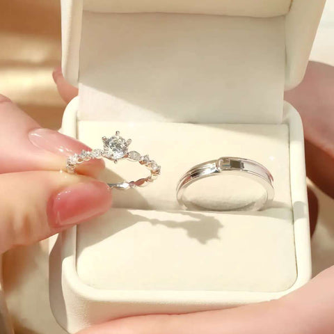 six prong solitaire engagement ring in jewelry box with matching band