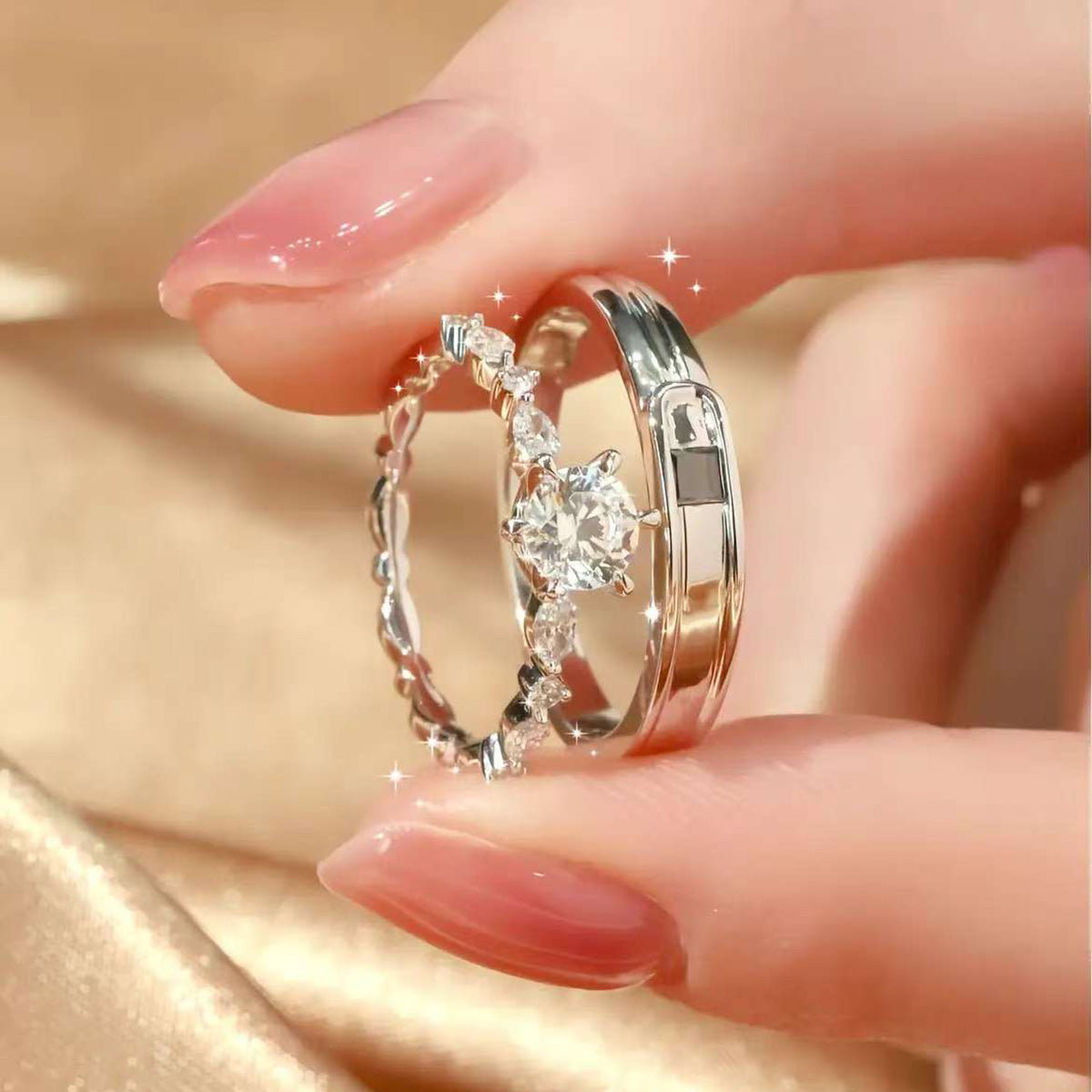 close-up of lock and key design couple rings on hand
