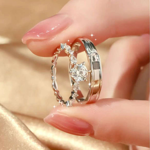close-up of lock and key design couple rings on hand