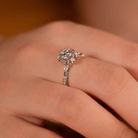 close-up sparkle of round center and cluster side stones