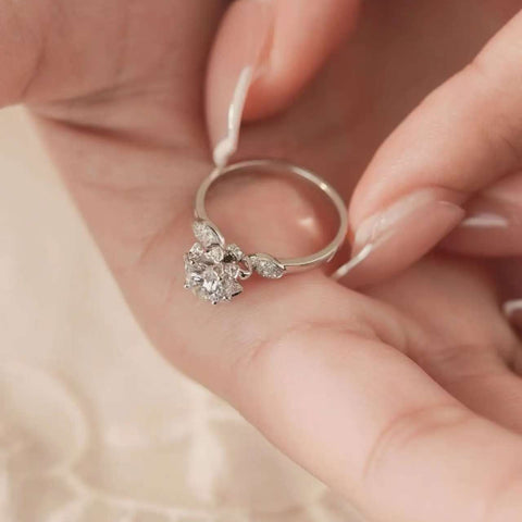 petal cluster lab diamond ring resting in jewelry box, minimalist floral style