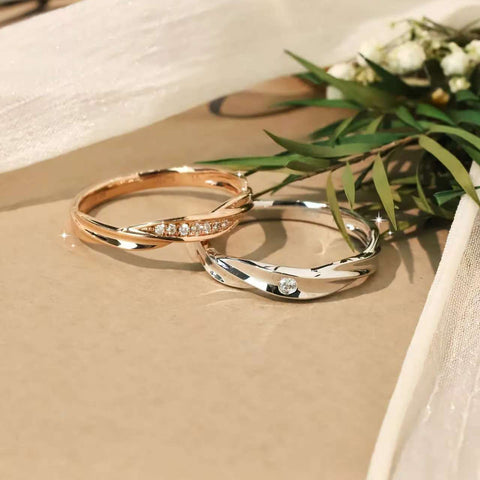 Minimalist couple rings with diamond accents, one rose gold pavé, one white gold single diamond, side by side