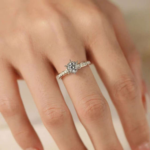 side view lab diamond ring on finger, hidden pear diamond under gallery