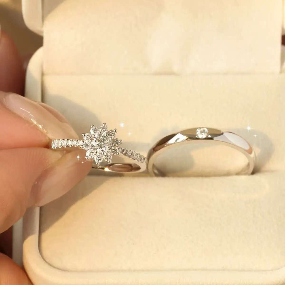 
Pair of matching lab grown diamond couple rings displayed in a jewelry box