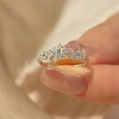 Front view of the ring revealing symmetrical star-like diamond arrangement