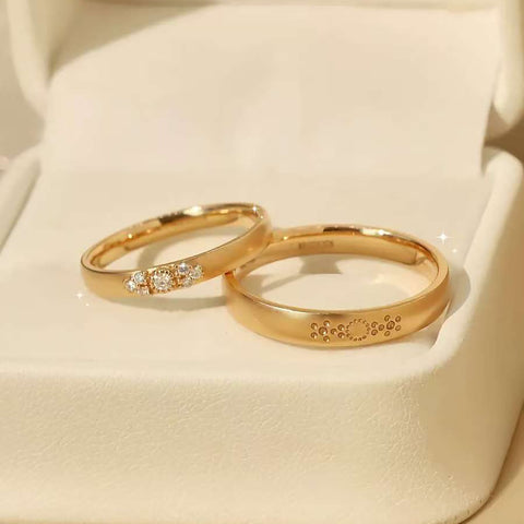 Sun-gleam duo ring set displayed in ivory jewelry box on satin surface